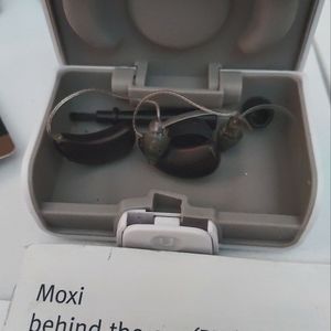 Moxie (bte) behind the ear hearing  device (gently used) w/1yr supply batteries